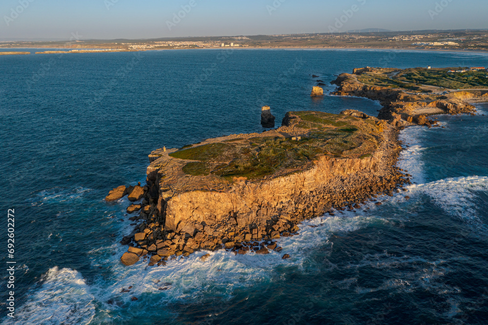 Aerial image of high rocky headland and peninsula of Peniche, Portugal