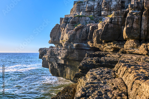 Obraz na płótnie Eroded rocks and sea waves of Atlantic ocean coast on sunny day w salonie