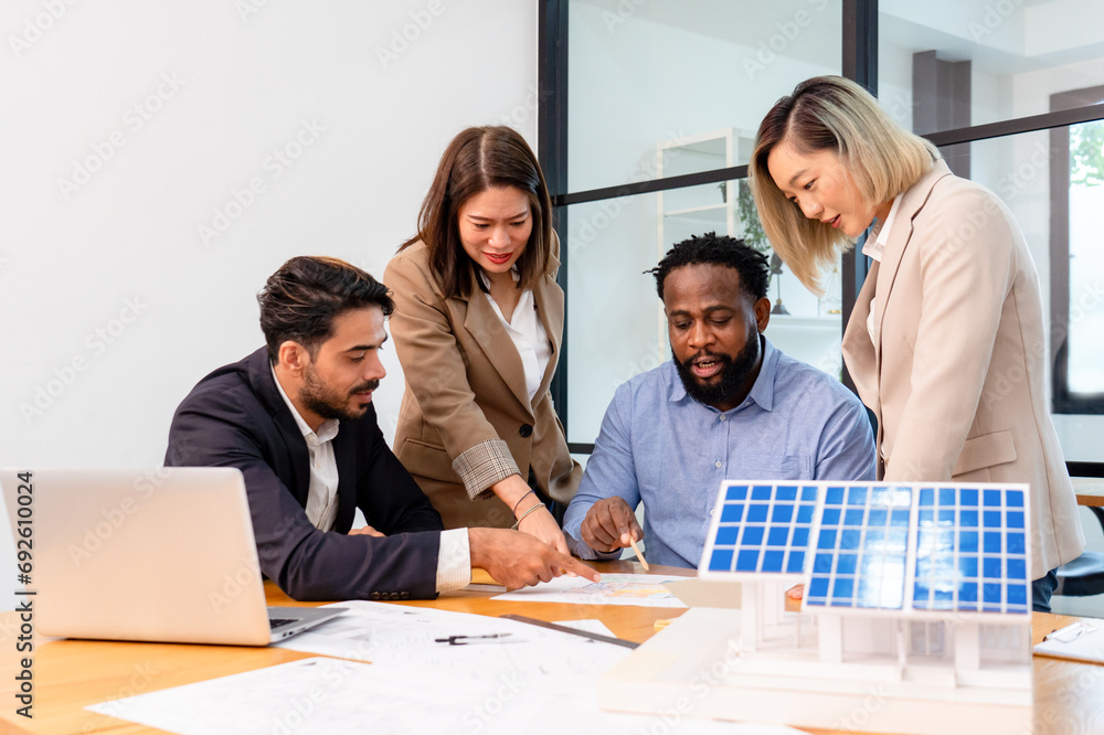 multiethnic coworkers discuss meeting on solar roof system project with solar panel house model, responsibility of green industry alternative renewable clean environment energy sustainable business multiethnic coworkers discuss meeting on solar roof system project with solar panel house model, responsibility of green industry alternative renewable clean environment energy sustainable business