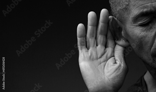 deafness suffering from hearing loss on grey black background with people stock image stock photo	