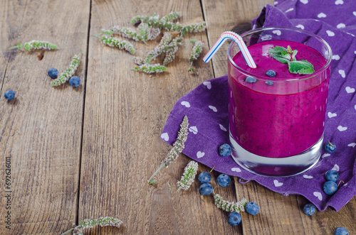 Fresh sweet blueberry smoothie with place for note