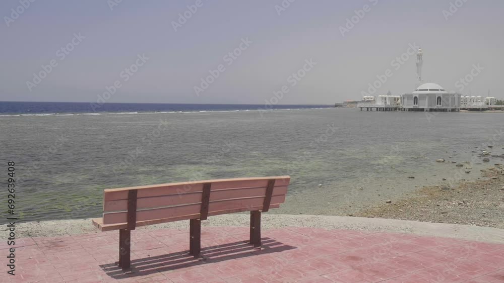 Bench and mosque on the background in the City of Jeddah in Saudi Arabia Bench and mosque on the background in the City of Jeddah in Saudi Arabia
