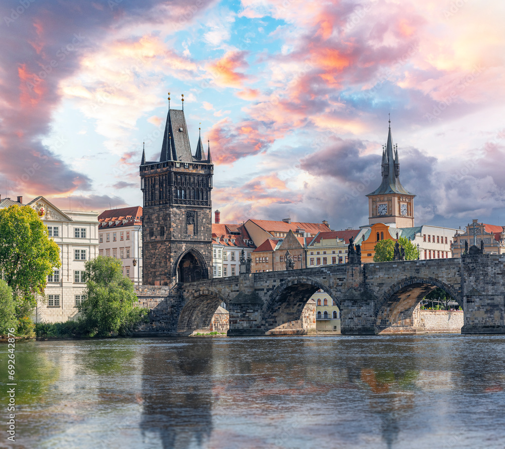 Prague - Charles bridge, Czech Republic. Scenic aerial sunset on the architecture of the Old Town Pier and Charles Bridge over the Vltava River in Prague, Czech Republic.