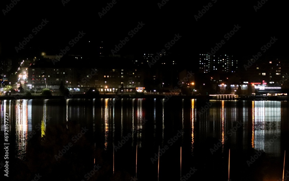 Night lights of the city reflected in the water of the Ternopil pond. Night lights of the city reflected in the water of the Ternopil pond.