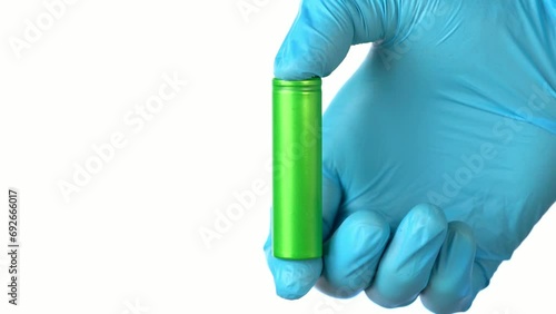 A man measures a li ion battery with a multimeter.