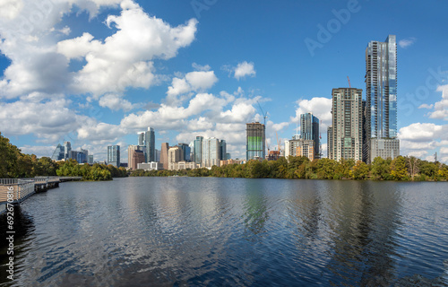 skyline of Austin in early morning light with mirroring city in the colorado river, Texas © travelview