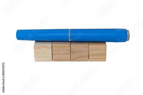 Semaglutide pen lying on blank wooden blocks. healthcare industry concept  photo