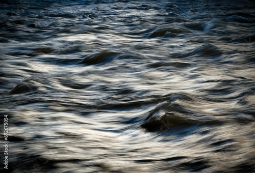 dark cold winter river with waves