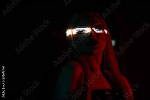 Fotografie Detail shot of drag queen performer on stage in dark with focus on eyes, copy sp