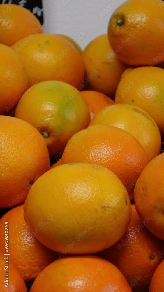 Vertical video of oranges in a market Vertical video of oranges in a market