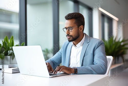 Busy professional business man company employee, male worker software developer, businessman looking at computer thinking on online market analysis using laptop working at office