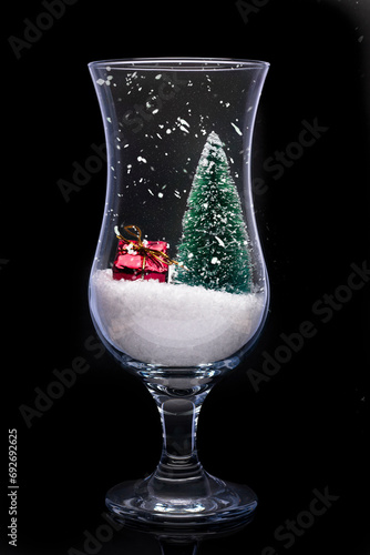 a christmas still life scene in a cocktail glass