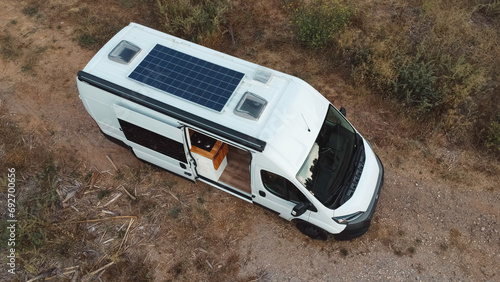 Overhead view of a camper van in which the solar panel on the roof can be seen.
Renewable energy, camper with solar panel on the roof