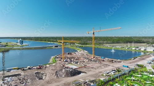 New construction site of developing residense in american city suburbs. Industrial tower lifting crane. Concept of housing growth in the USA photo