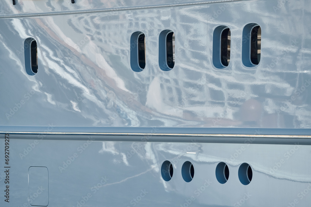 reflections on glossy board of mega boat, tranquillity in port Hercules, windows of moored boat at sunny day, Monaco, Monte-Carlo reflections on glossy board of mega boat, tranquillity in port Hercules, windows of moored boat at sunny day, Monaco, Monte-Carlo