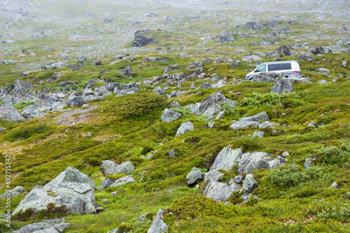 Car on Gamle Strynefjellsvegen scenic route, Norway photo