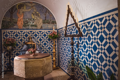 Chapel with baptistery covered in tiles and mosaic with the baptism of Jesus in Our Lady of tears church, Dornes PORTUGAL photo