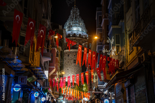 galata tower istanbul with turkey flags photo