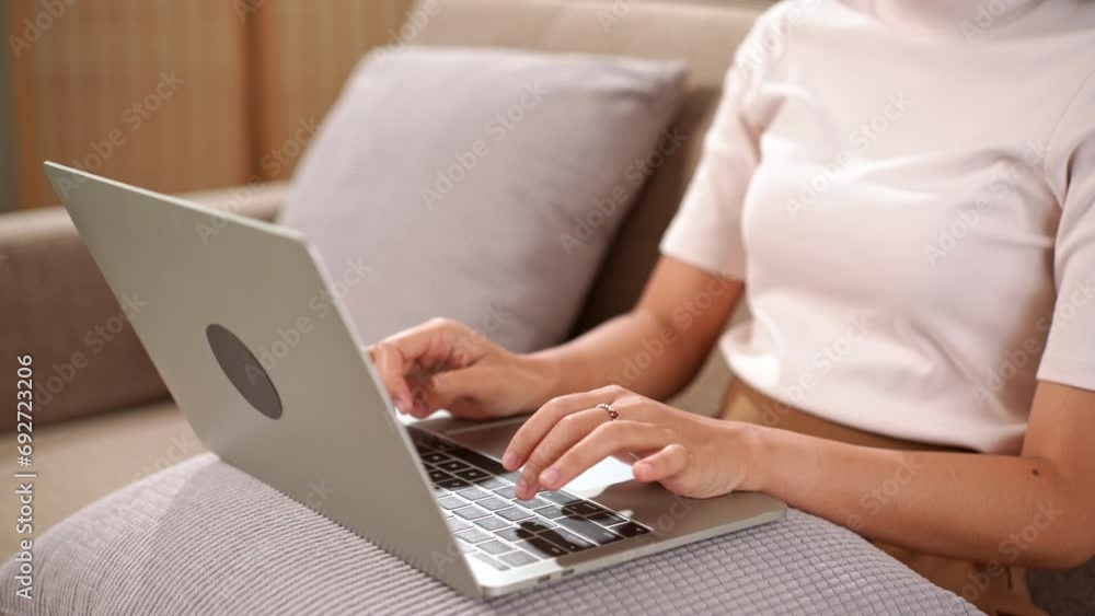 Closeup of asian business woman hands using laptop computer to typing texting chatting to sending email for client or shopping online Closeup of asian business woman hands using laptop computer to typing texting chatting to sending email for client or shopping online