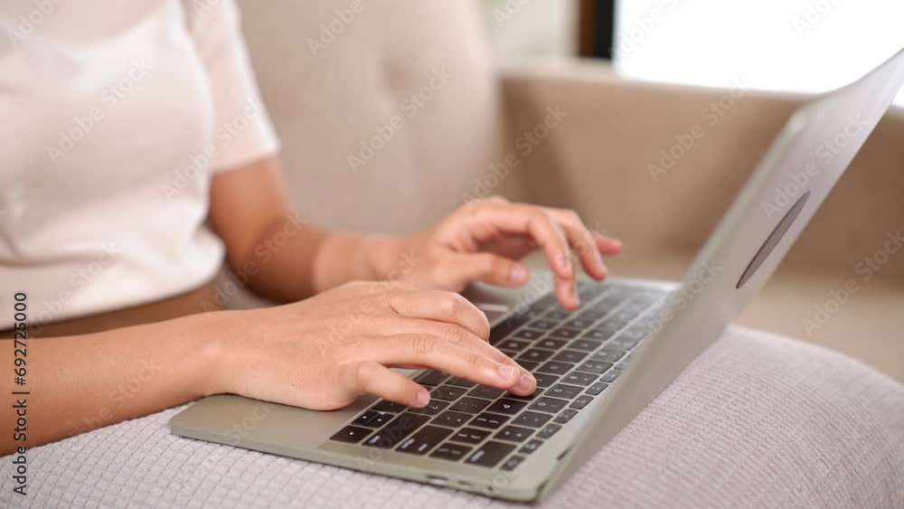Closeup of asian business woman hands using laptop computer to typing texting chatting to sending email for client or shopping online Closeup of asian business woman hands using laptop computer to typing texting chatting to sending email for client or shopping online