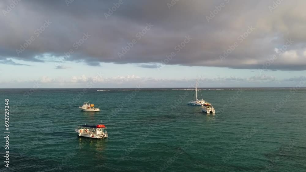 Hovering over ocean and watching sunrise on boats at Turks and Caicos islands' Grace Bay Hovering over ocean and watching sunrise on boats at Turks and Caicos islands' Grace Bay