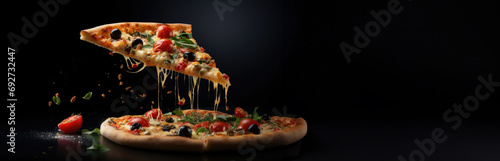 A hovering pizza piece with cheese, tomatoes, greens, and olives in motion, set against a dark background