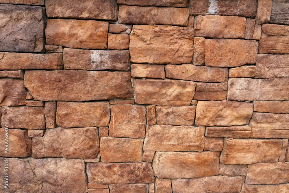 Background of an old wall made of red stone. Background of an old wall made of red stone.