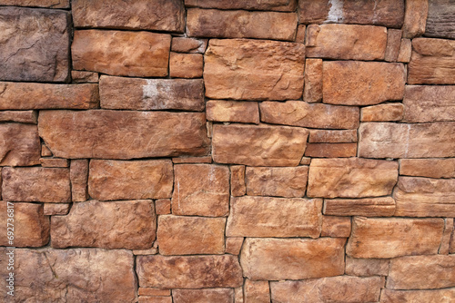 Background of an old wall made of red stone.