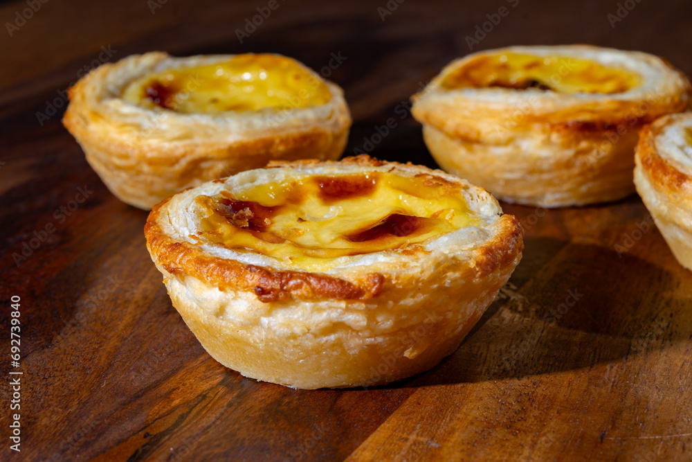 Portugal's traditional sweet dessert Pastel de nata egg custard tart pastry in cup