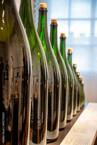 Different size of champagne bottles, traditional making champagne sparkling wine from chardonnay and pinor noir grapes, Epernay, Champagne, France photo