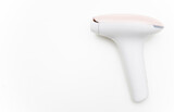 Photo of a pulsed light hair removal gun on a white background.Pulsed light laser.IPL.Copyspace for advertising