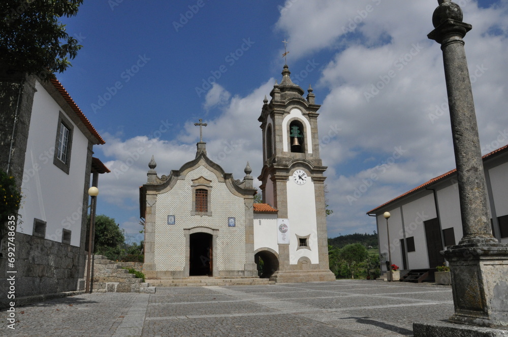 Catholic Church at Summer day with White clouds and Blue sky