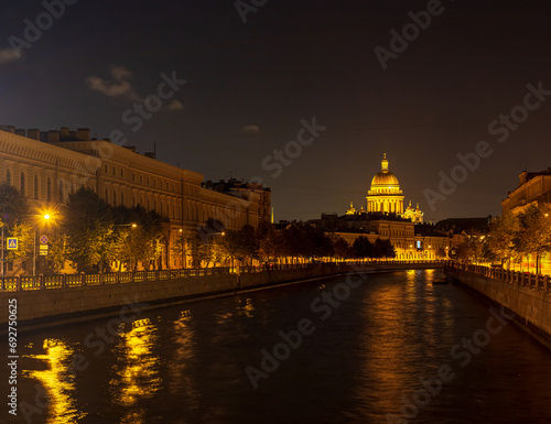 Beautiful night view of the Moika River and St. Isaac's Cathedral from the Kiss Bridge, St. Petersburg, Russia.