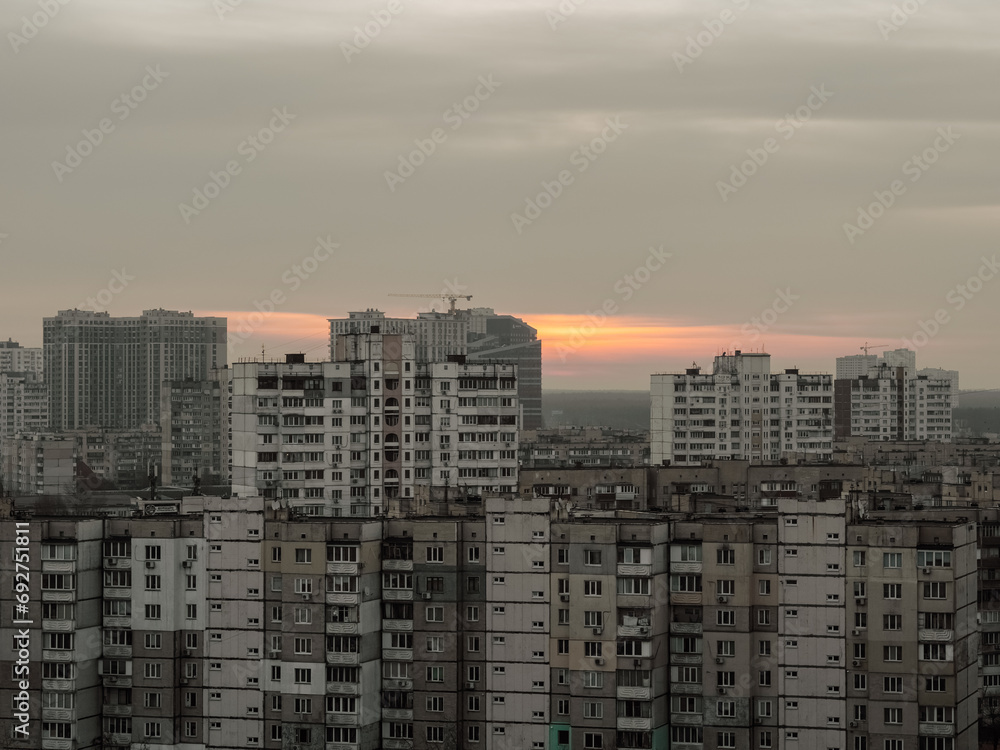 Old Soviet high-rise buildings. Sunrise, sunset against the background of old high-rise buildings.