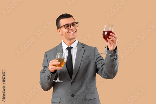 Young sommelier with glasse...