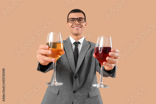 Young sommelier with glasse...