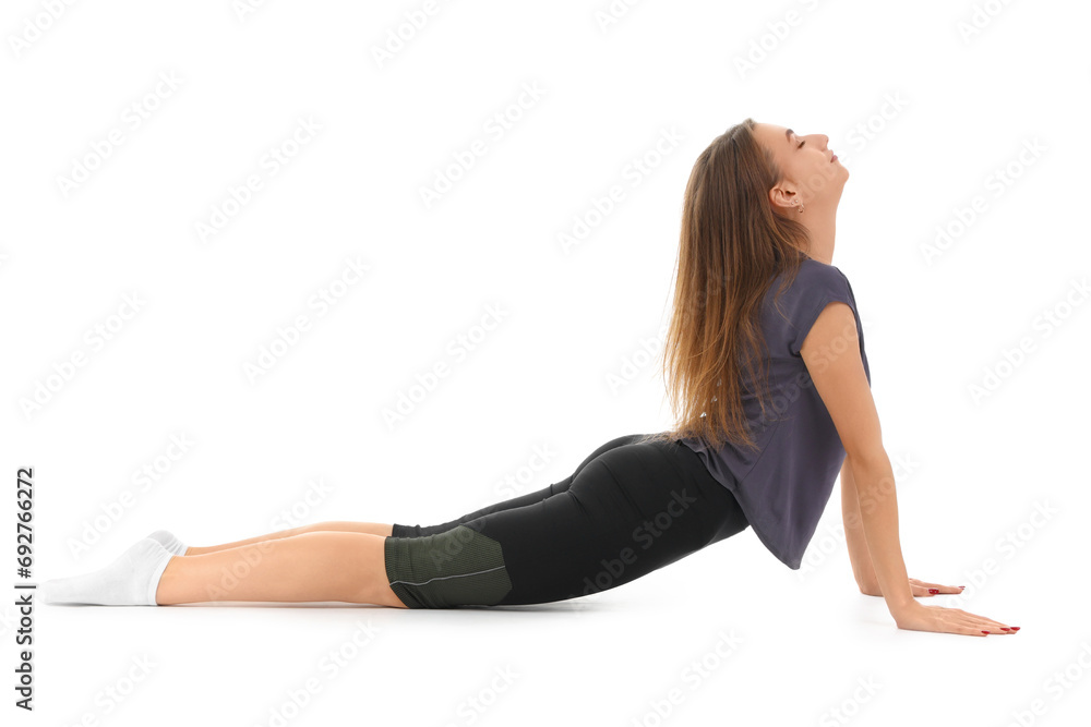 Young woman doing yoga on white background