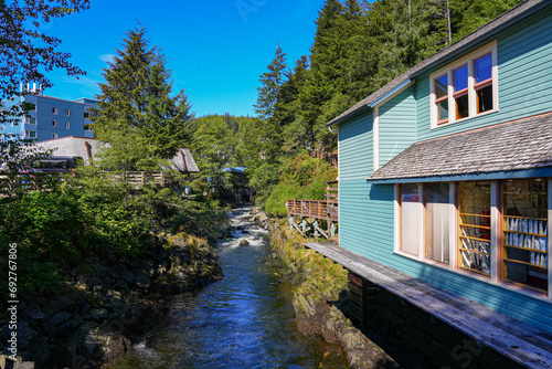 Rapids flowing by the historic wooden buildings of Creek Street in Ketchikan, built on a raised boardwalk above Ketchikan Creek - Popular tourist area in Alaska, USA
