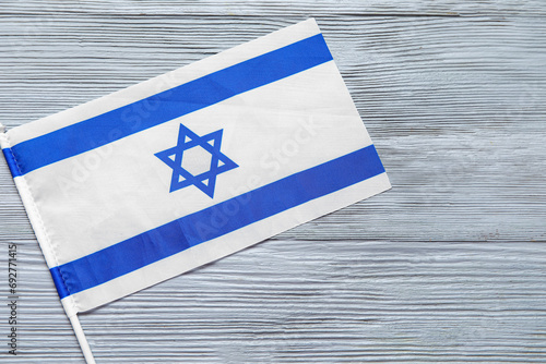 Flag of Israel on grey wood...