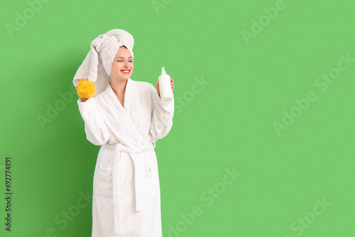 Young woman in bathrobe wit...
