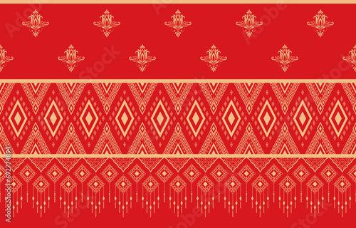 Golden tribal pattern on red background used as ethnic tribal decoration for wallpaper and printed fabric.