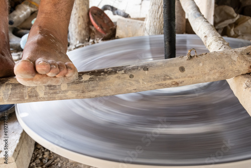 An artisan is seen making ceramic works in Maragogipinho in the city of Aratuipe, Bahia. photo