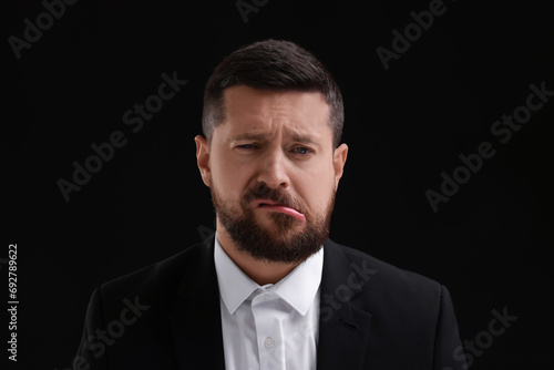 Personality concept. Emotional man on black background