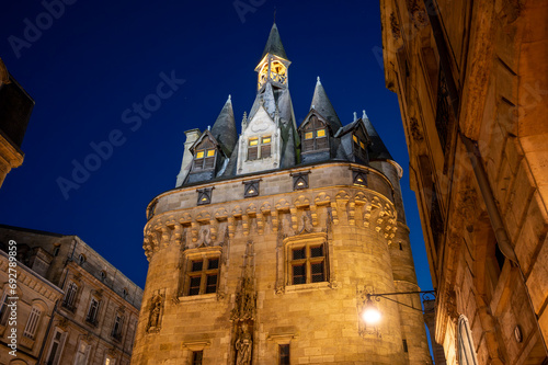 Night view of the Porte Cailhau or Porte du Palais. The former town gate of the city of Bordeaux in France. One of the main touristic attractions of the French city. High quality photography. photo