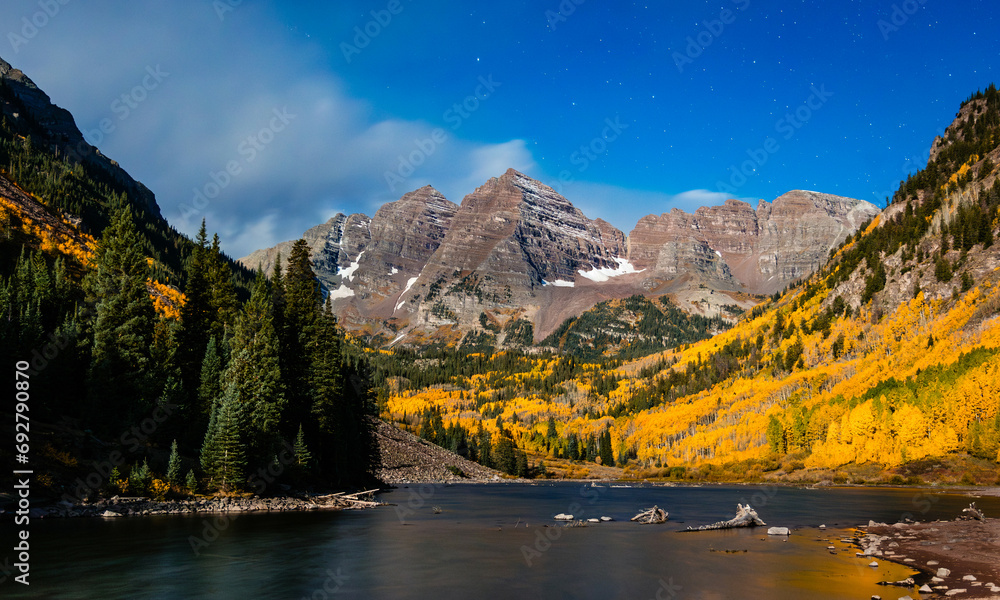 Maroon Bells in the fall near Aspen Colorado at night with stars