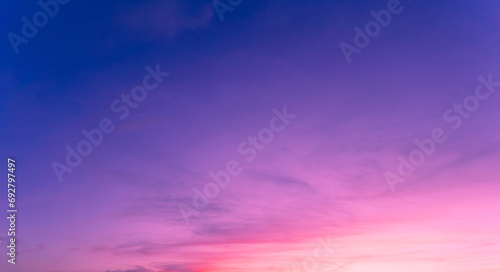 Twilight in the Evening with Orange Gold Sunset, Real amazing panoramic sunrise or sunset sky with gentle colorful clouds. Nature background, Sky background. #692797497