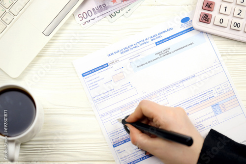 Accountant fill french tax form 10963 Value added tax and similar taxes in end of tax period. Taxation and paperwork routine in France photo