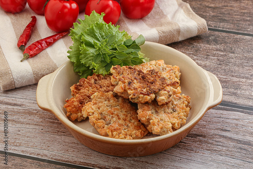 Fried salmonn cutlet in the bowl photo