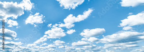 Beautiful blue sky and white cumulus clouds abstract background. Cloudscape background. Blue sky and fluffy white clouds on sunny days. Blue sky and daylight. World Ozone Day. Ozone layer. Summer sky. © Artinun