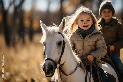 Joyful Children Riding a White Horse in Autumn Sunshine  © Distinctive Images